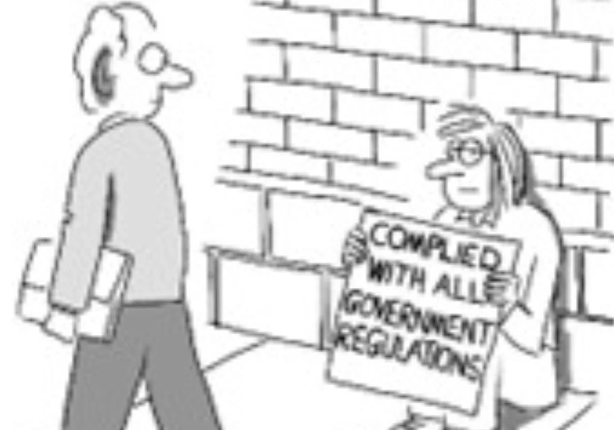 A cartoon of two people holding signs in front of brick wall.